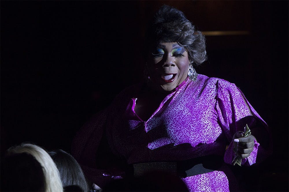 Patricia Yolanda Weave dances through the rows of audience members in the VIP section of Alumni Hall on Thursday. Weave was one of multiple acts to perform during the Pride Extravaganza Drag Show.