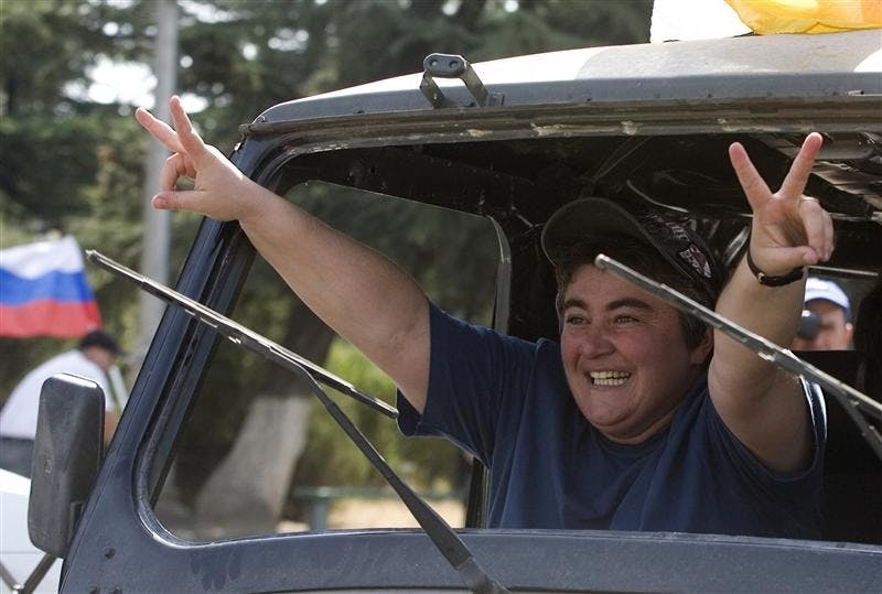 A woman gestures, as she rides in a car, Tuesday in Tskhinvali, the capital of Georgia's separatist-controlled territory of South Ossetia, as local residents celebrate Medvedev's signing of the decree recognizing the independence of the breakaway Georgian territories of South Ossetia and Abkhazia. Defying the United States and Europe, Russian President Dmitry Medvedev announced Tuesday he has signed a decree recognizing the independence of the breakaway Georgian territories of South Ossetia and Abkhazia.