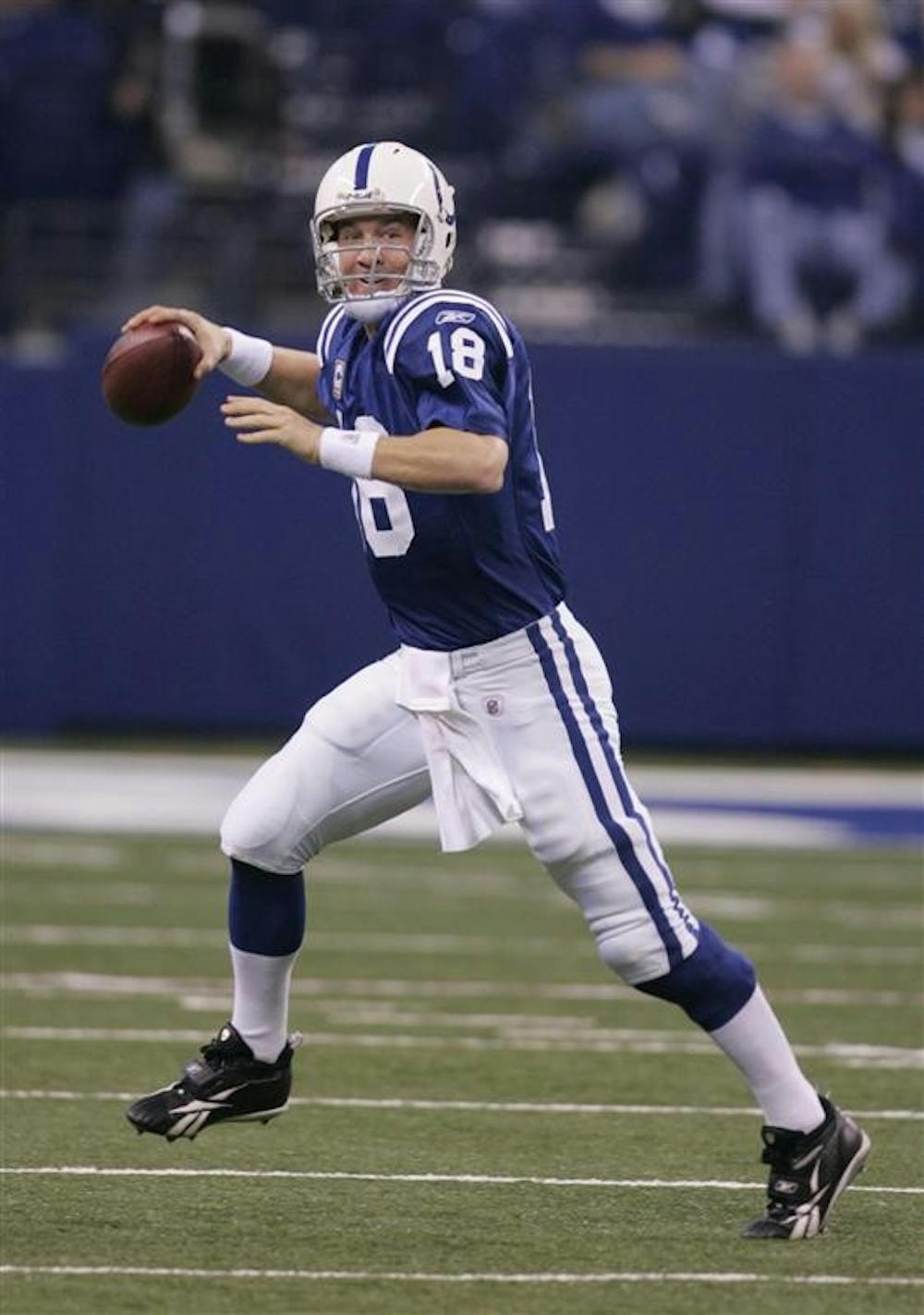 Indianapolis Colts quarterback Peyton Manning looks for a receiver during the second half of a NFL football game against the Houston Texans Sunday in Indianapolis. Manning looks at the last three weeks and sees progress. Not perfection.