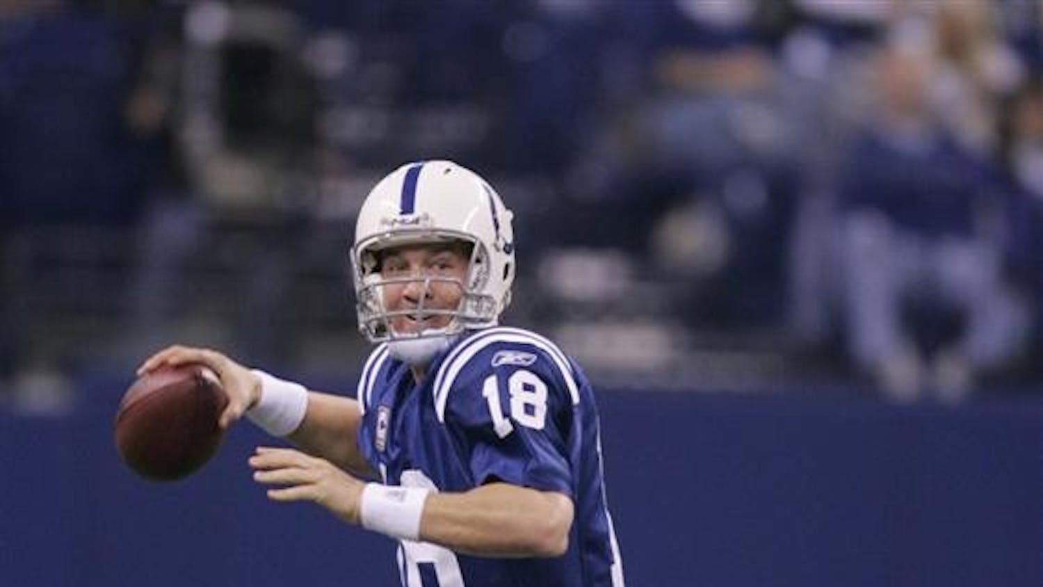 Indianapolis Colts quarterback Peyton Manning looks for a receiver during the second half of a NFL football game against the Houston Texans Sunday in Indianapolis. Manning looks at the last three weeks and sees progress. Not perfection.