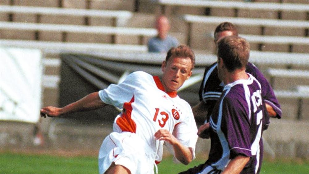Former senior forward Aleksey Korol splits two Texas Christian University defenders to attempt a shot on goal on Sunday, Sept. 19, 1999 in Indianapolis. Korol was named Big Ten Player of the Year, NSCAA All-America and Soccer America Player of the Year for the 1999 season and joined the Indiana coaching staff in February 2009.