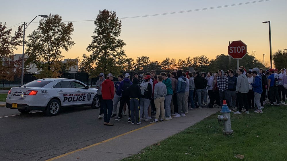 Protesters gather at 6:30 p.m. Friday at the intersection of North Jordan Avenue and North Fee Lane to protest sexual violence. The demonstration was organized by Zeta Beta Tau and over 100 members participated.