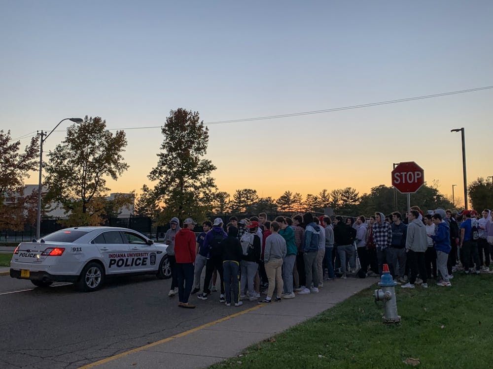Protesters gather at 6:30 p.m. Friday at the intersection of North Jordan Avenue and North Fee Lane to protest sexual violence. The demonstration was organized by Zeta Beta Tau and over 100 members participated.