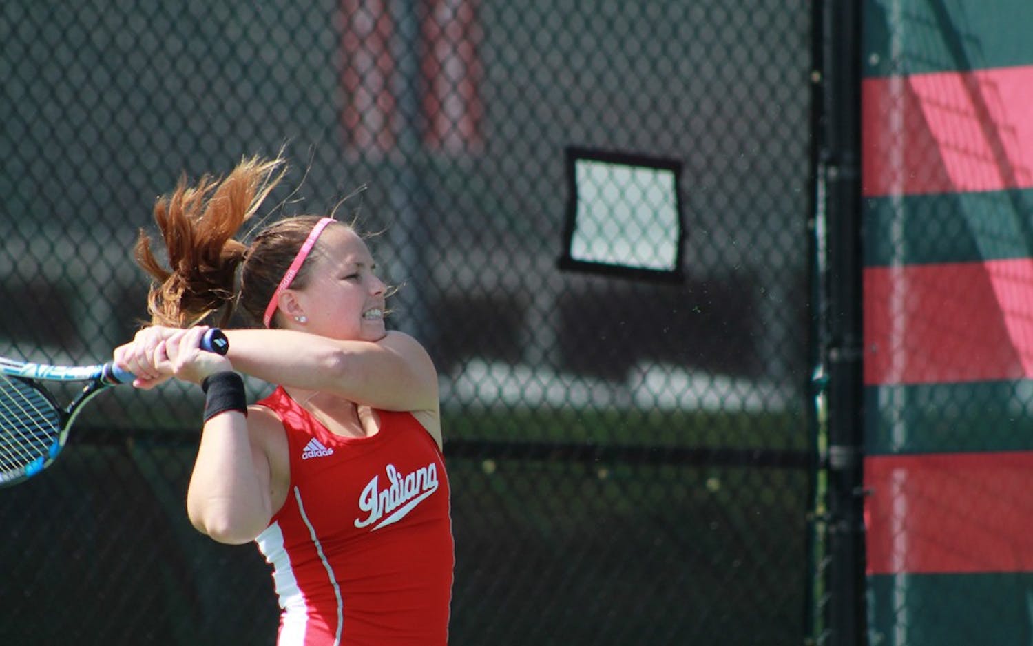 Graduate senior,&nbsp;Alicia Robinson hits the ball in a singles match Sunday morning. The Hoosiers took on the Wildcats in their final home match of the season.&nbsp;