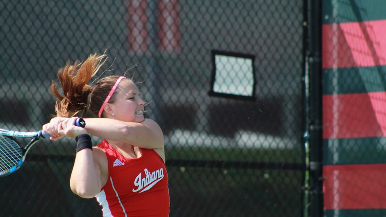 Graduate senior, Alicia Robinson hits the ball in a singles match Sunday morning. The Hoosiers took on the Wildcats in their final home match of the season. 