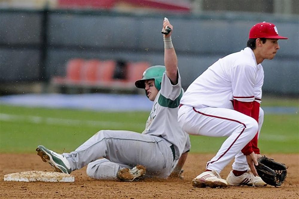 Chicago State's Albert Carpen slides into second in front of junior infielder Jake Dunning on March 31 at Sembower Field. The Hoosiers face Louisville at 4 p.m. today on the road.