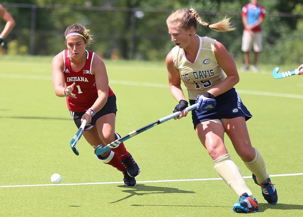 Junior Rachel Stauffer vies for the ball in the IU field hockey game versus UC Davis at the Field Hockey Complex on Sunday. 
