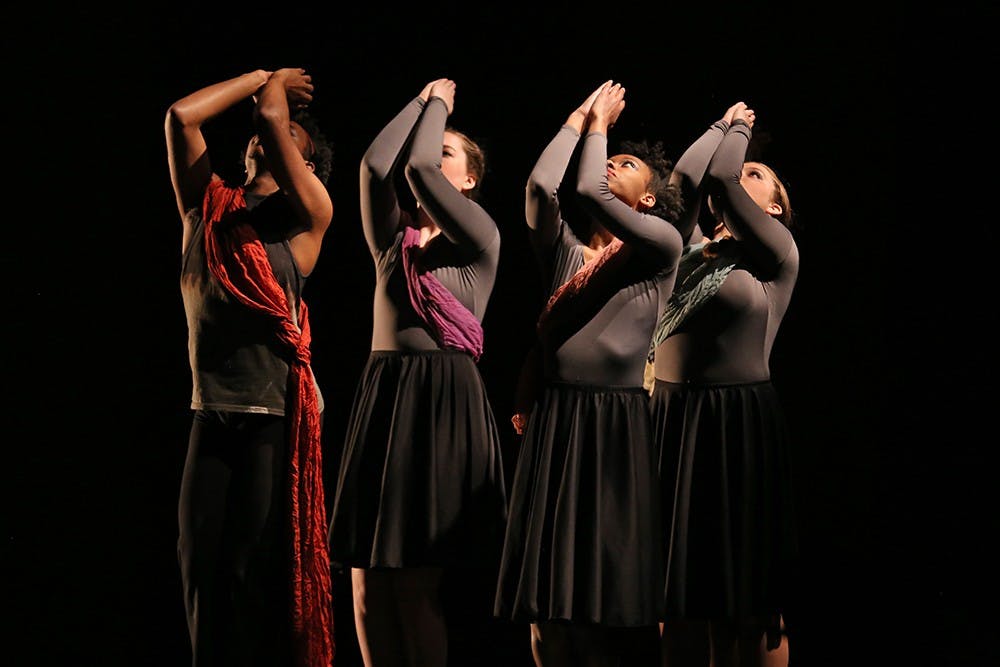 Performers in the "Falling Out of Grace" routine perform an upwards reach during Hammer & Nail at the Buskirk-Chumley Theatre on Wednesday evening. Hammer & Nail is promoted as "an annual collaboration between composers and choreographers from IU Contemporary Dance and the Jacobs School of Music." "Falling Out of Grace" is a project based on the Birmingham bombings. 