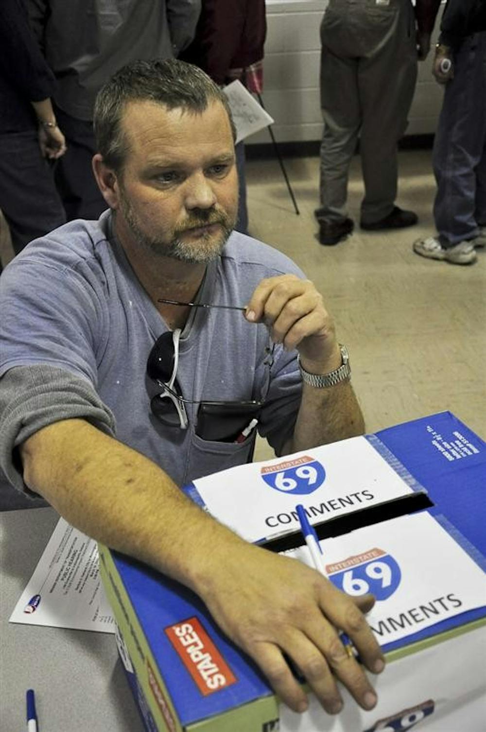 Stan Brewster of Petersburg, Ind. talks with a neighbor about losing land to construction of Section 2 of Interstate 69. The 29-mile stretch of highway will take over 1,800 acres of land from Washington, Ind. to Oakland City, Ind.