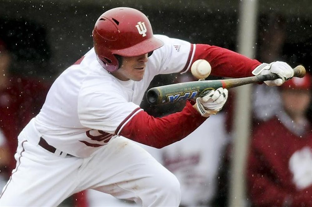 Junior infielder Tyler Rogers bunts during a game against Chicago State Tuesday afternoon at Sembower Field. The Hoosiers won 11-4.