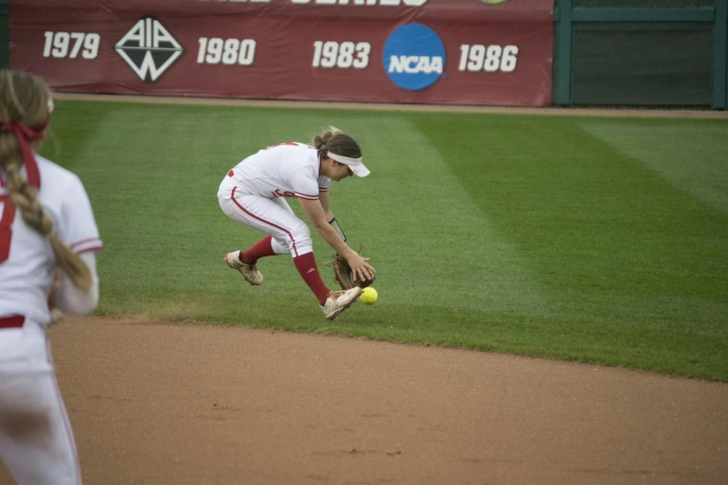 Second baseman Erin Lehman fields a grounder in the gap in hopes of making a play at first during the second of two games against the Boilermakers on Tuesday. IU beat Purdue 4-0 in the first game while Purdue took the second 2-1.