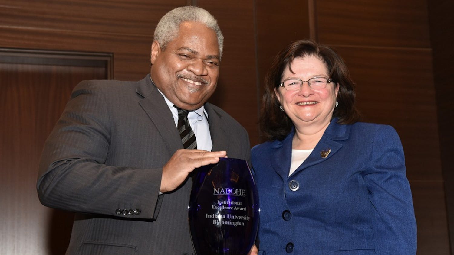Associate Professor of Business Law&nbsp;Martin McCrory, left, accepts the Institutional Excellence Award from awards chair Carmen Suarez. IU announced that McCrory will resign from his position as&nbsp;associate vice president for the Office of the Vice President for Diversity, Equity and Multicultural Affairs.