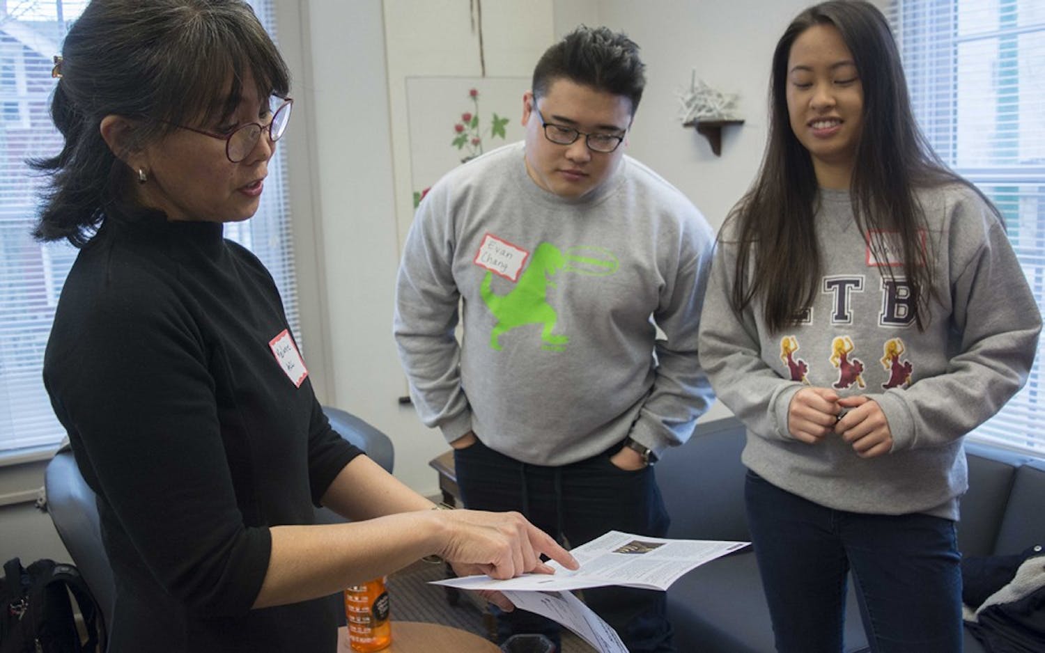 Melanie Castillo-Cullather, director of Asian Culture Center, talks to Evan Chang (middle), 2nd year graduate student, and Malina Xiong, senior in speech and hearing sciences major, before the workshop at Asian Culture Center, Jan 13.