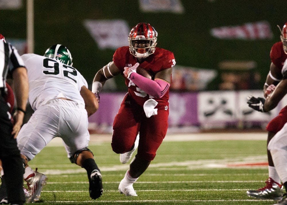 Then-freshman running back Tyler Natee, now a sophomore, runs the ball against Michigan State during an October 2016 game. Natee was one of two IU players to announce their intent to transfer to a different school this past week via Twitter.