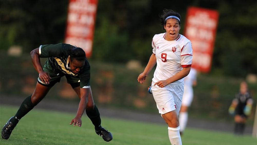 Senior Orianica Velasquez dribbles past a University of South Florida defender Aug. 24 at Bill Armstrong Stadium.