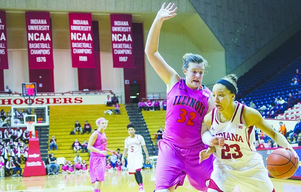 Sophomore guard Alexis Gassion stops her drive before an Illinois defender attempts to strip the ball on Wednesday at Assembly Hall. The Hoosiers won 85-58.
