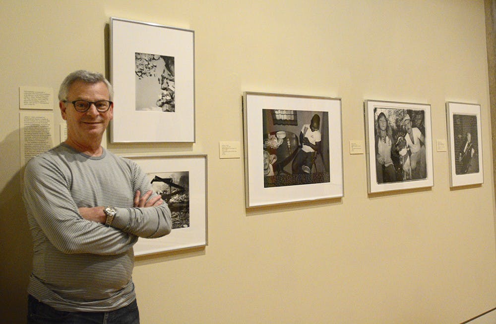 Jeffrey Wolin stands in front of his works displayed at IU Art Museum on Thursday afternoon. About 20-25 of Wolin's photos are also displayed at Pictura Gallery.