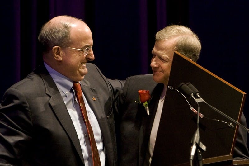 IU President Michael McRobbie embraces Curt Simic, President and CEO of the IU Foundation, during Simic's retirement celebration Friday afternoon at the Musical Arts Center. Simic served as president of the IU Foundation since 1988 and during his tenure helped raise IU's endowment to 1.6 billion dollars.