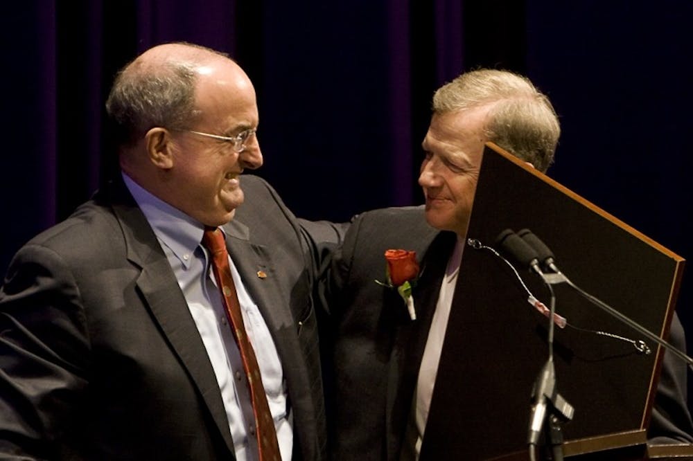IU President Michael McRobbie embraces Curt Simic, President and CEO of the IU Foundation, during Simic's retirement celebration Friday afternoon at the Musical Arts Center. Simic served as president of the IU Foundation since 1988 and during his tenure helped raise IU's endowment to 1.6 billion dollars.
