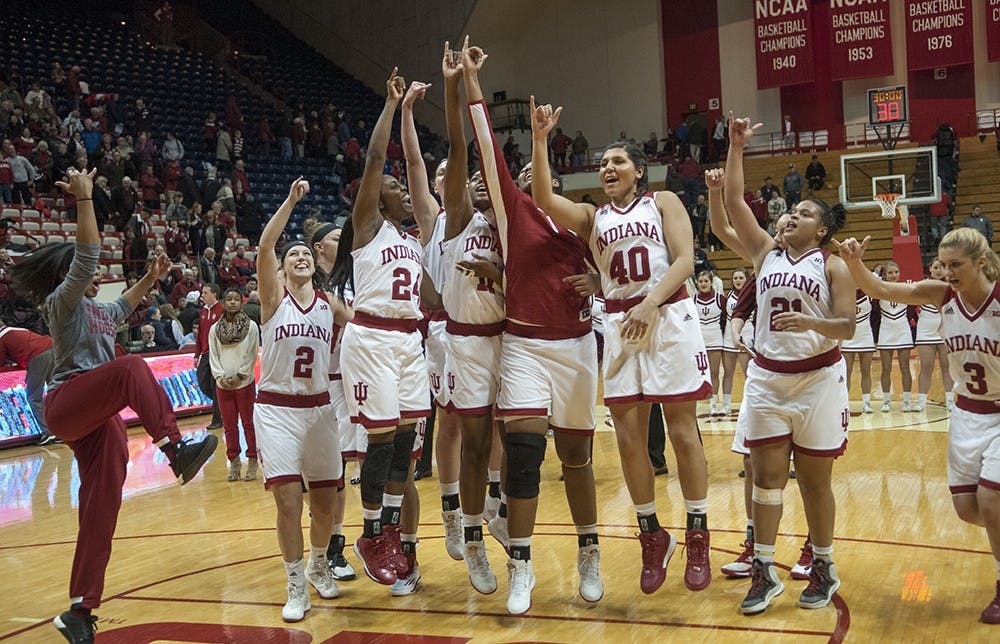 Members of the IU baskerball team celebrate after defeating Illinois, 68-66 Wednesday at Assembly Hall. 