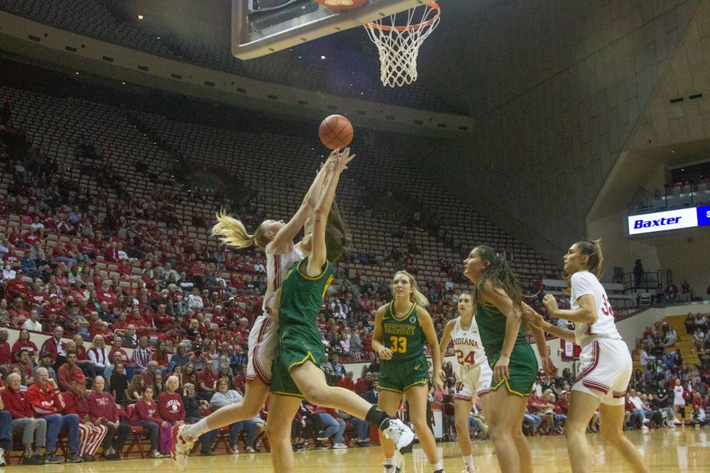 <p>Indiana and the University of Vermont players fight over the ball Nov. 8, 2022, at Simon Skjodt Assembly Hall. Indiana beat Vermont 86-49.</p>