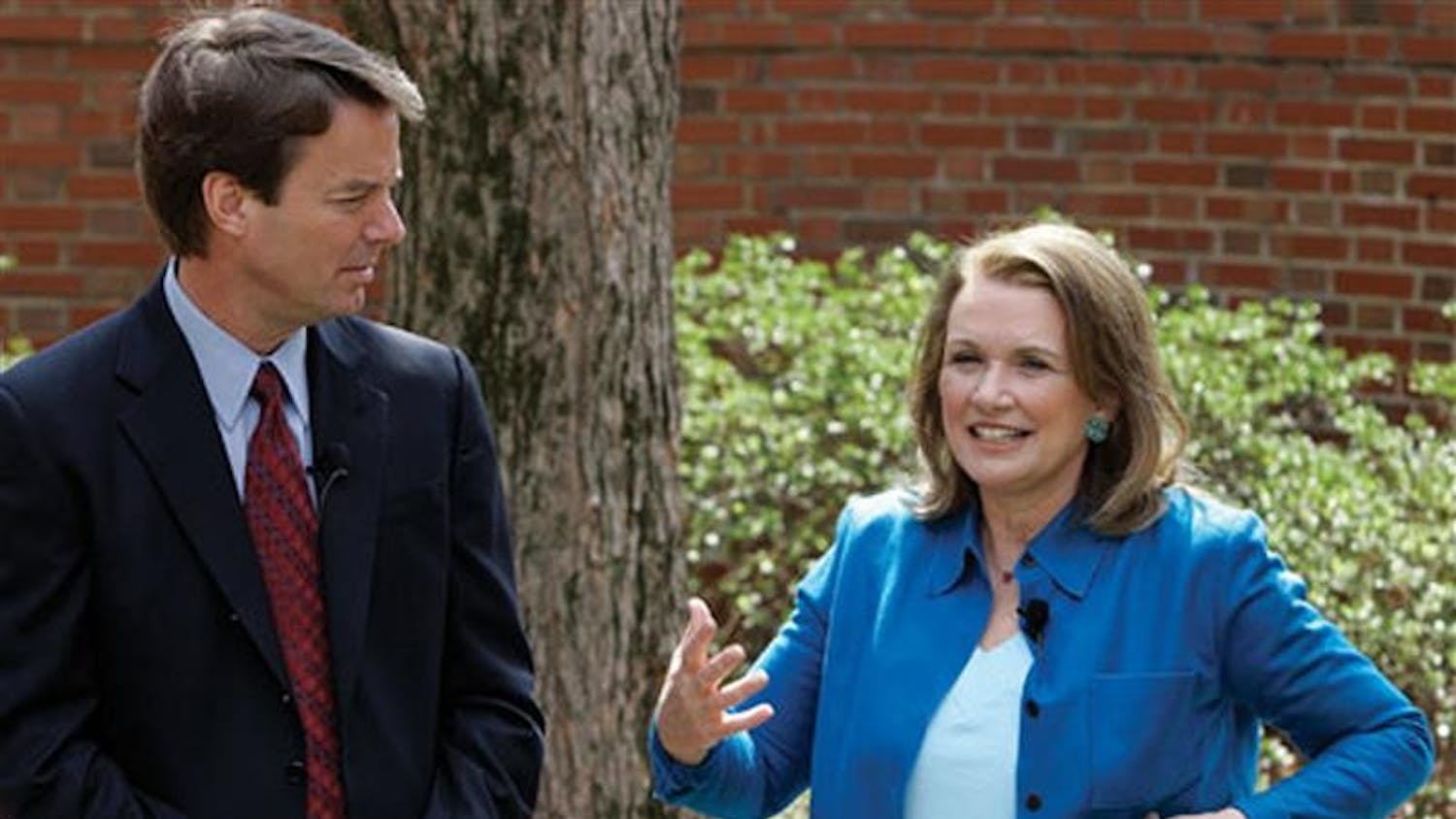 The-democratic presidential hopeful John Edwards listens as his wife Elizabeth speaks about her recurrence of cancer during a news conference on March 22 in Chapel Hill, N.C. Edwards will speak at the IU Auditorium at 7 p.m. today.