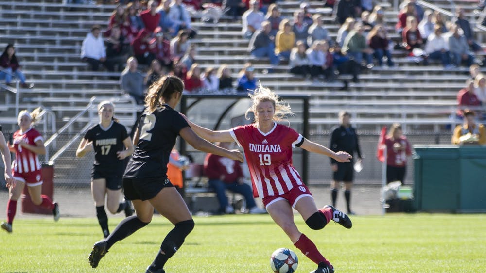 Senior Chandra Davidson tries to move the ball across the field Oct. 27 at Bill Armstrong Stadium. IU beat Michigan State on Wednesday to secure its spot in the Big Ten tournament.