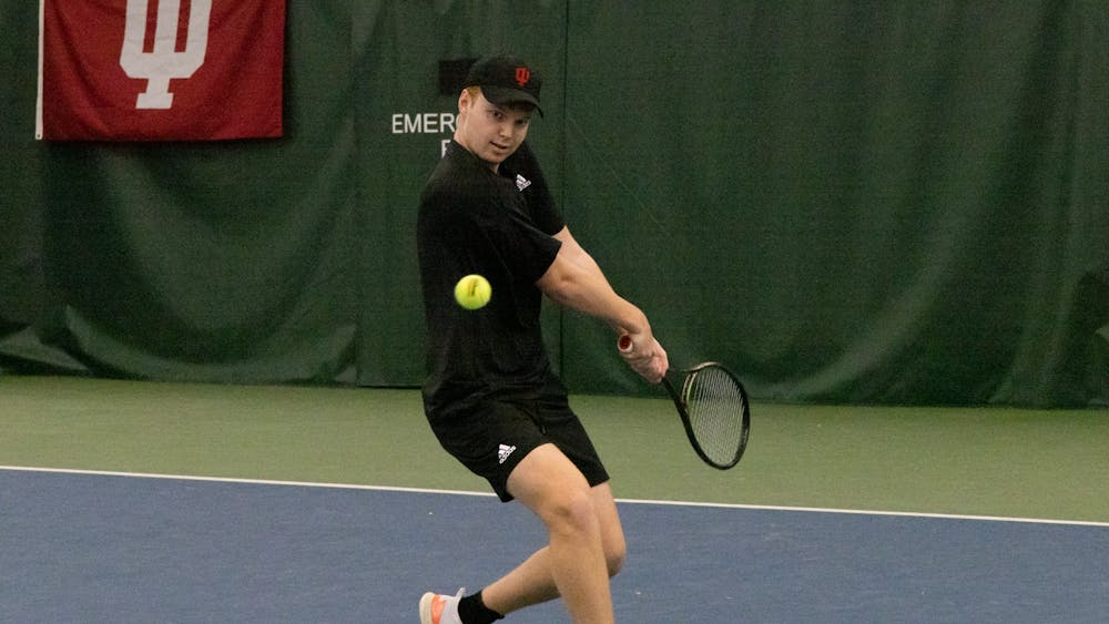 Junior Ilya Tiraspolsky sets up for a backhand winner against Southern Indiana on Feb. 12, 2023, at the IU Tennis Center. This weekend, Indiana beat Purdue 7-0 overall.