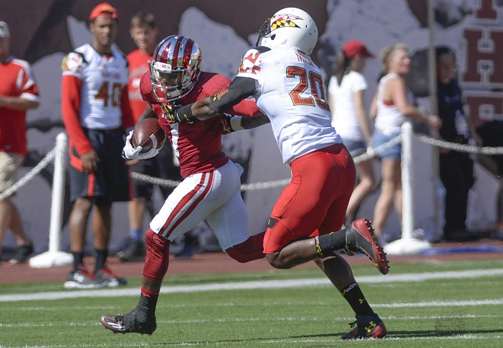 Senior receiver Shane Wynn runs with the ball during IU's game against Maryland on Saturday at Memorial Stadium.