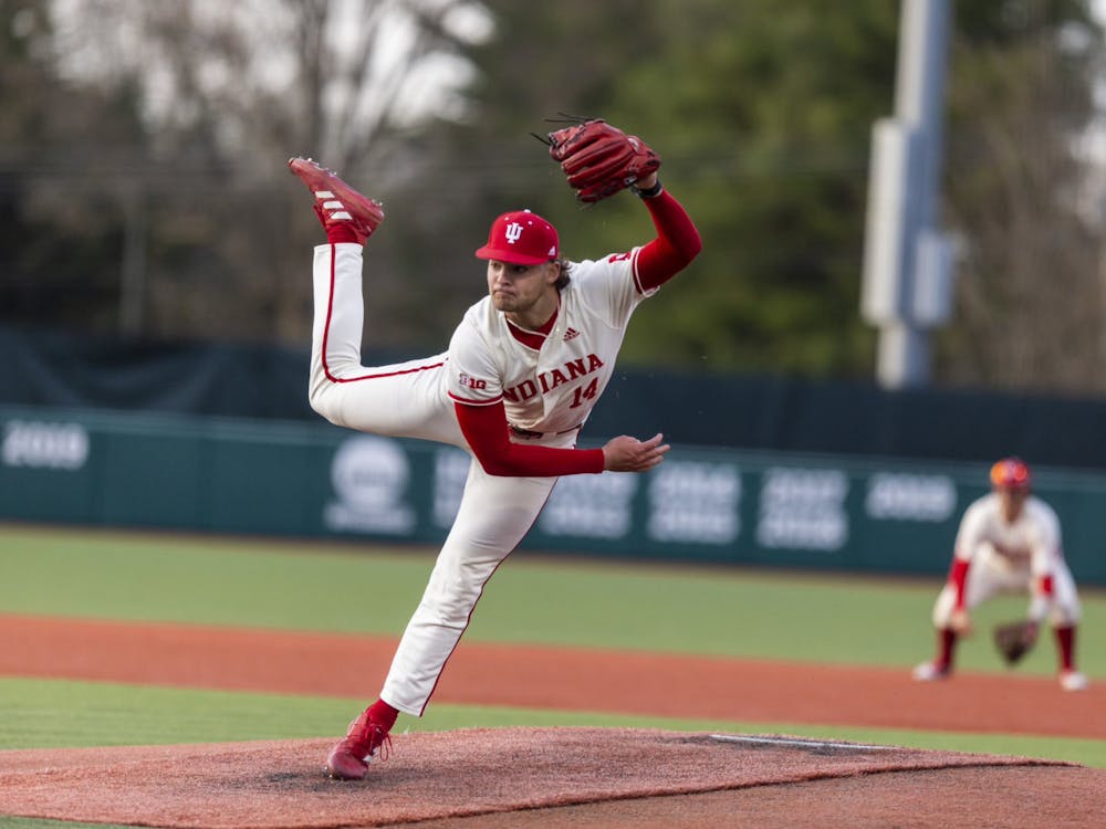 Freshman Connor Foley throws a pitch April 7, 2023, at Bart Kaufman Field in Bloomington. Foley&#x27;s third save of the season secured Indiana&#x27;s 40th victory of the 2023 season Saturday. 