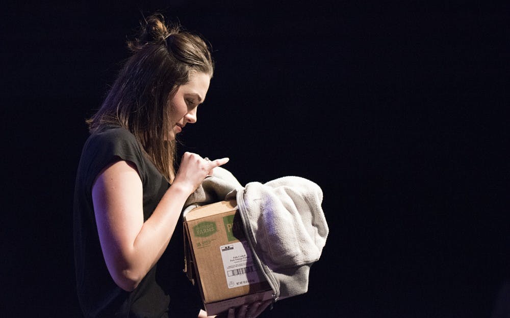Holly Wampler performs part of the last section of Rupi Kaur's "Milk and Honey" called "The Healing." In this scene, Wampler's character holds a box of items that she has to decide to throw away after her break-up with her boyfriend. 