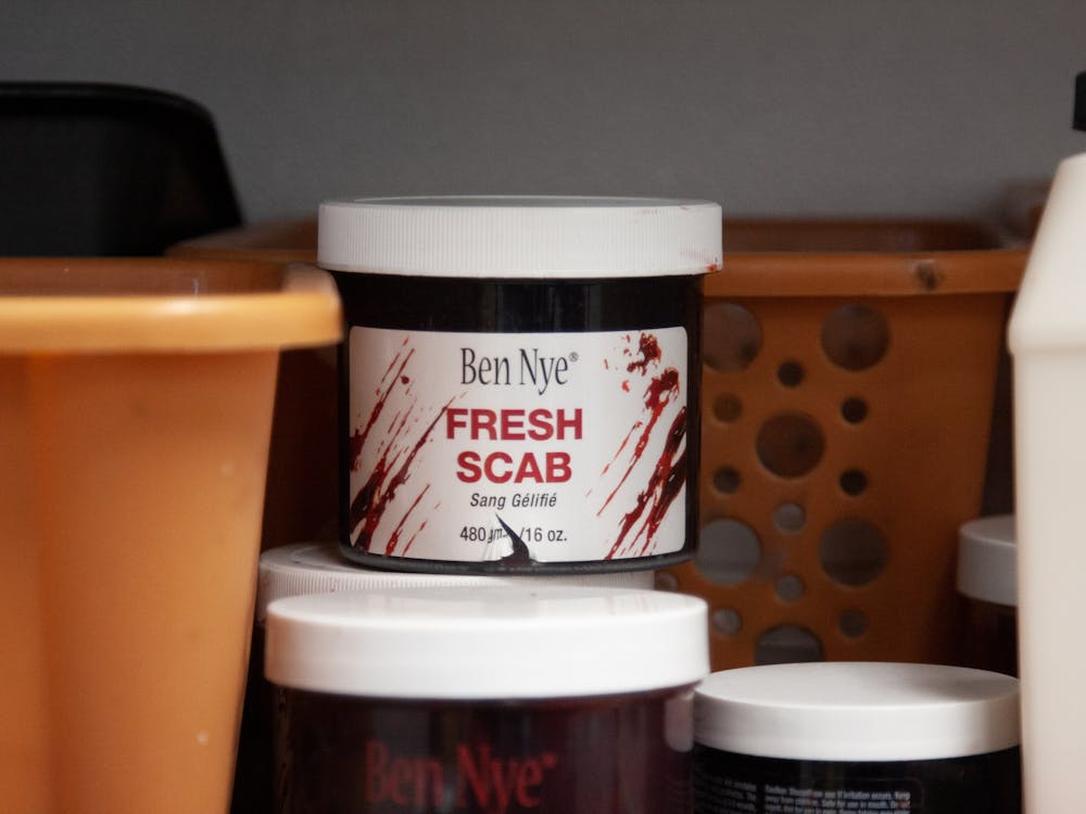 A tub of goopy red makeup called &quot;Fresh Scab&quot;﻿ sits on a shelf in the makeup room at Indy Scream Park on Oct. 23, 2022. Jodi Morgan, the park&#x27;s head makeup manager, uses Fresh Scab to transform actors into creepy zombies in just a couple of minutes.