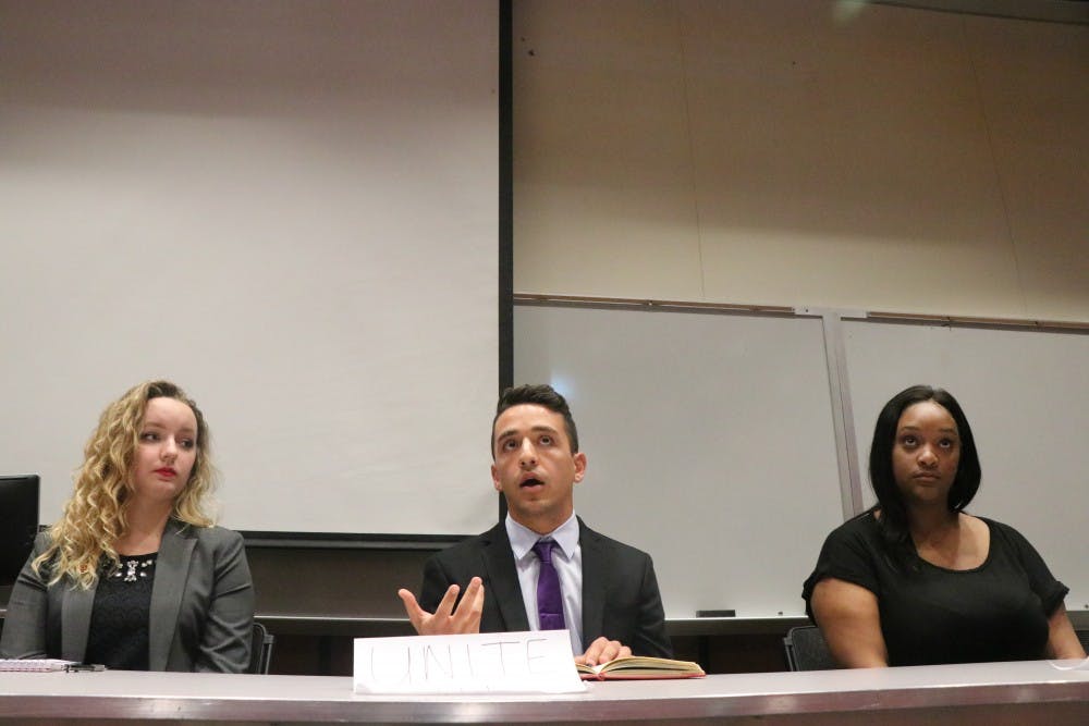 <p>Junior Kevin Mohsenzadeh speaks during the IU Student Association debate Wednesday night in Hodge Hall. Mohsenzadeh is running on the Unite IU ticket for IUSA, and his campaign stands to support for diversity on campus.</p>