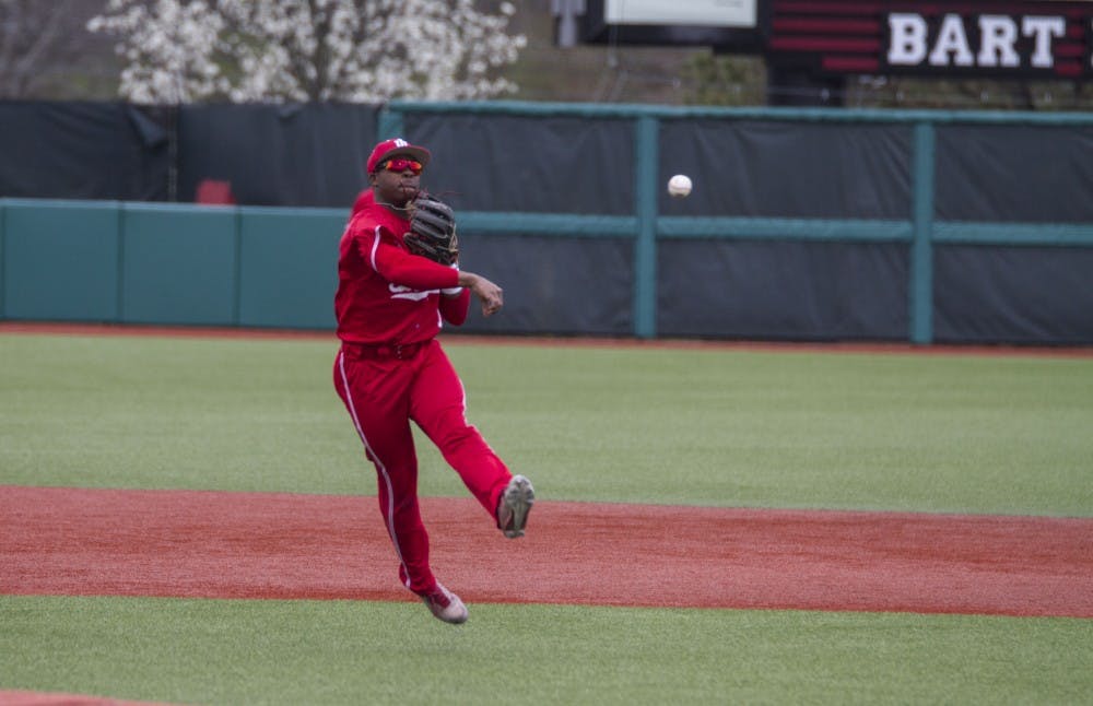 <p>Shortstop Jeremy Houston throws the ball and gets the out on first against Northwestern on April 15. IU will play Louisville on Tuesday night.</p>