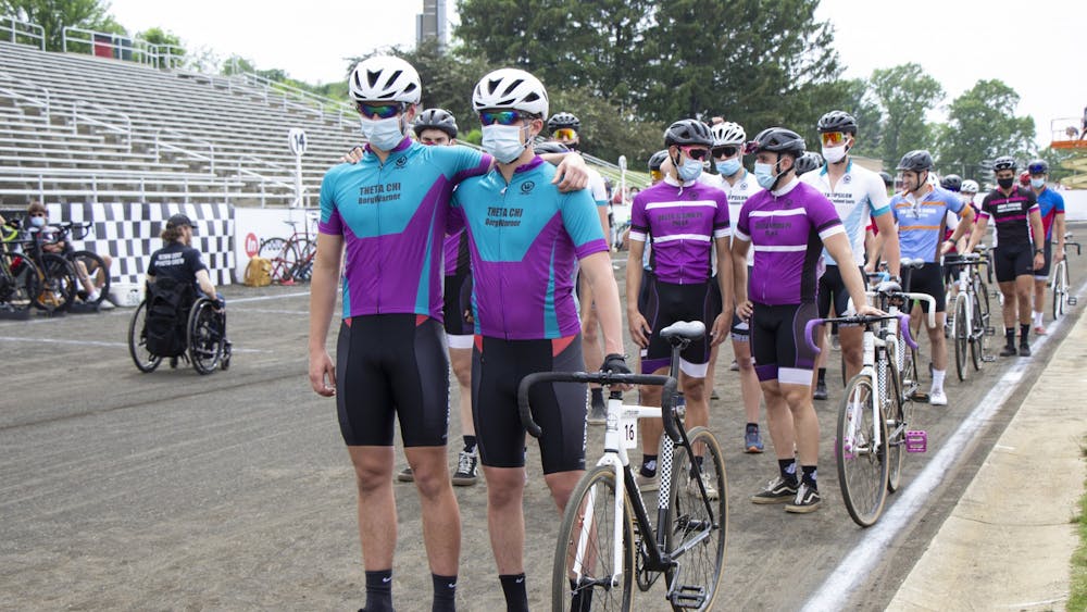 Theta Chi riders stand together prior to the Little 500 on May 26. Theta Chi finished 171 laps despite only having two riders.
