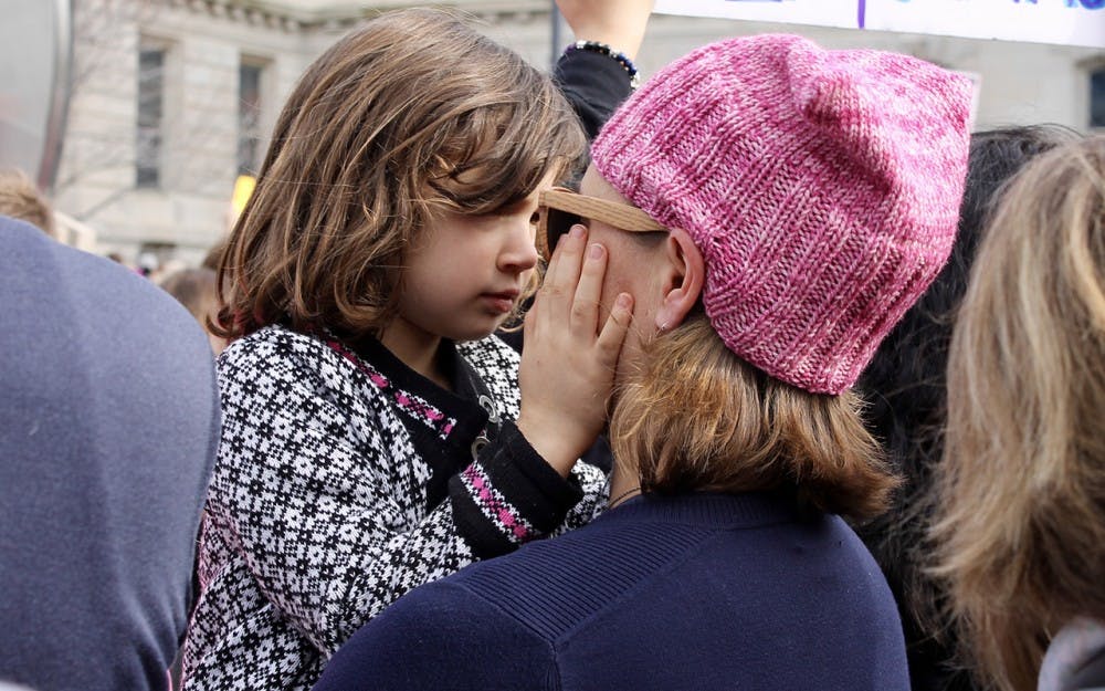 A mother and daughter embrace&nbsp;during the Women's March in Indianapolis on Saturday.