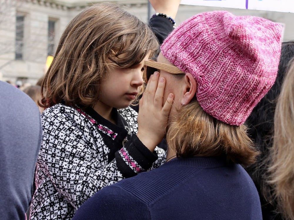 A mother and daughter embrace&nbsp;during the Women's March in Indianapolis on Saturday.