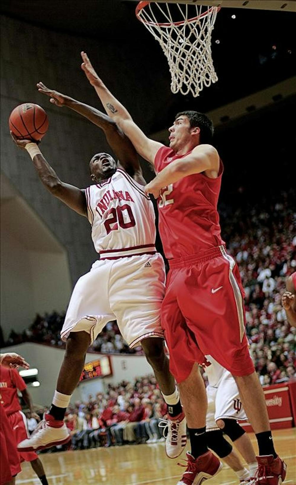 Freshman guard Nick Williams fights off a Buckeye defender during a shot attempt Saturday afternoon at Assembly Hall. The Hoosiers fell to Ohio State 93-81.