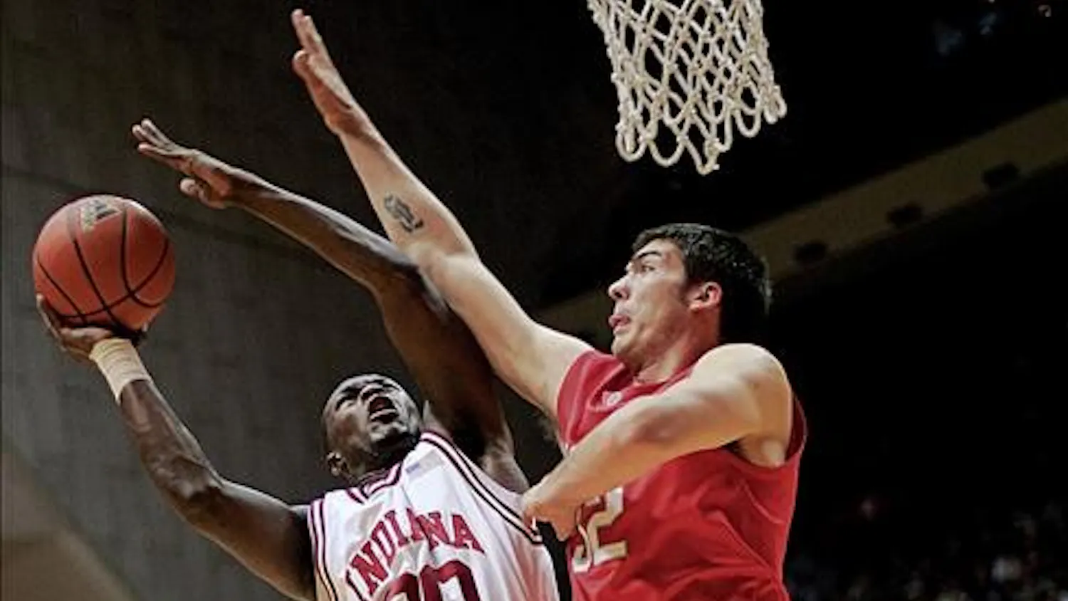 Freshman guard Nick Williams fights off a Buckeye defender during a shot attempt Saturday afternoon at Assembly Hall. The Hoosiers fell to Ohio State 93-81.