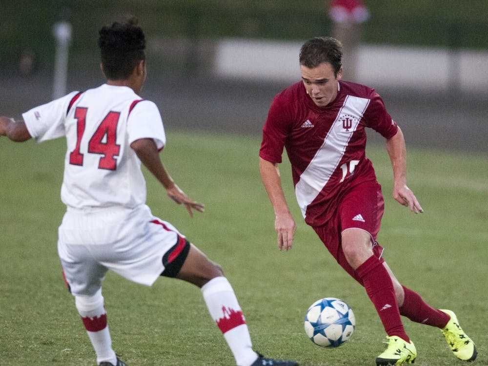 Freshman defender Andrew Gutman dribbles the ball during IU's 2-1 win against St. John's on Friday at Bill Armstrong Stadium.