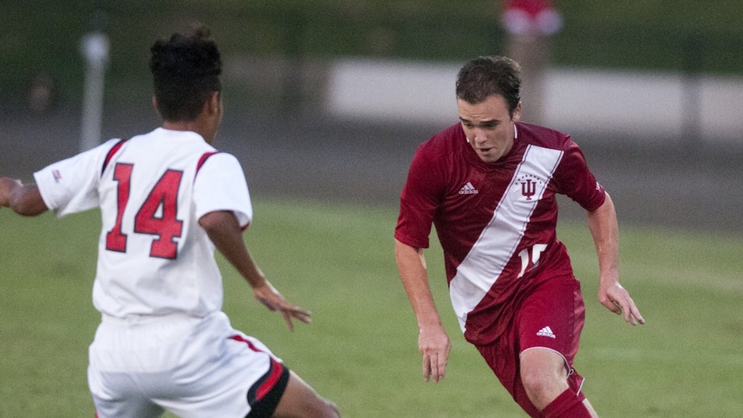 Freshman defender Andrew Gutman dribbles the ball during IU's 2-1 win against St. John's on Friday at Bill Armstrong Stadium.