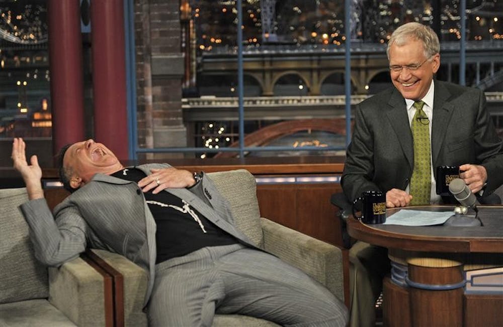 Robin Williams enjoys a laugh with David Letterman on Wednesday. It was Williams' first television appearance since his heart surgery.