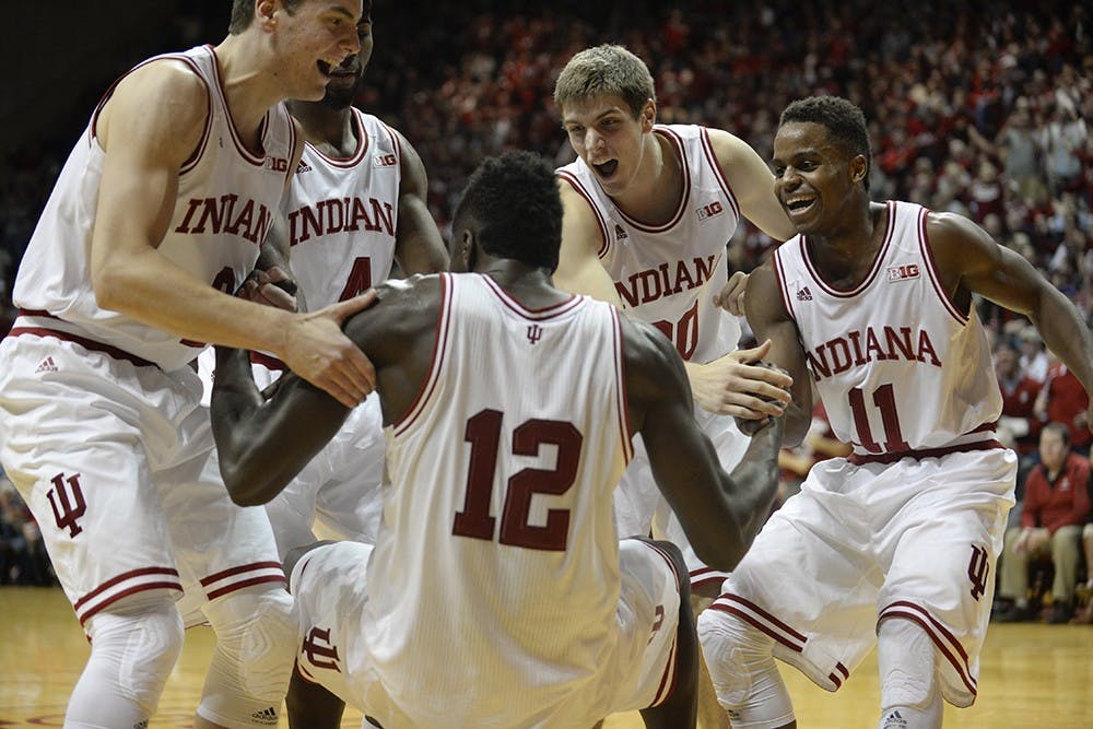 The Hoosiers help up junior Hanner Mosquera-Perea after he took a charge in IU's game against Southern Methodist. The foul gave IU momentum, ultimately leading to a 74-68 victory over the Mustangs.