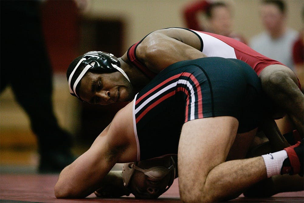 Junior Nate Jackson holds down Clayton Bass of SIU during the 174 lbs match on Dec. 5. Jackson won the match 16-1, scoring 10 points in just the first period helping the Hoosiers secure a 25-12 victory over the Eagles. 