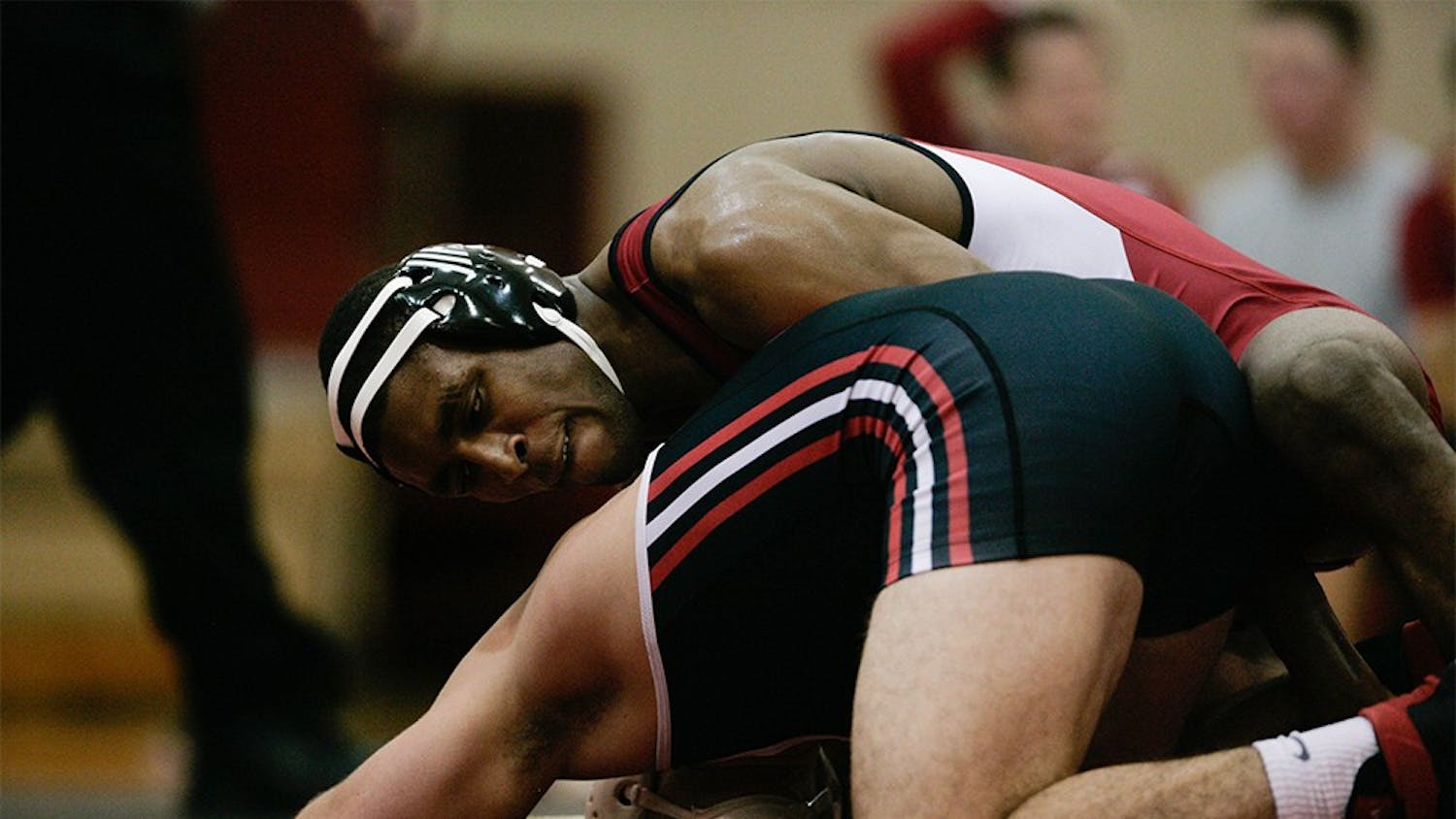 Junior Nate Jackson holds down Clayton Bass of SIU during the 174 lbs match on Dec. 5. Jackson won the match 16-1, scoring 10 points in just the first period helping the Hoosiers secure a 25-12 victory over the Eagles. 