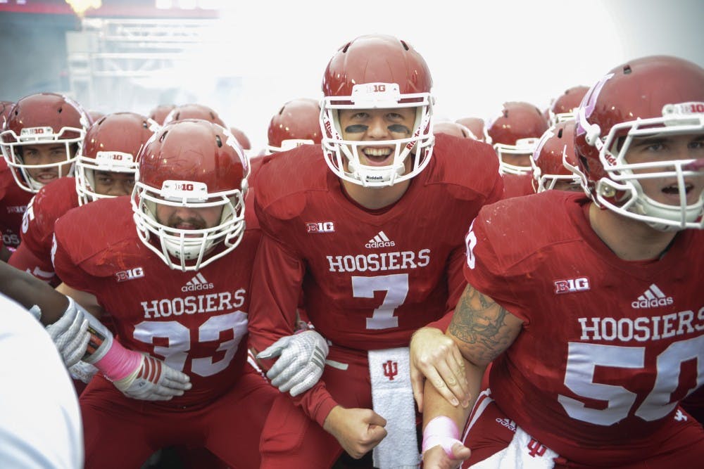The team gets pumped up by coach Mark Hill before the game against Ohio State on Saturday at Memorial Stadium. The Hoosiers lost to the number one ranked Buckeyes, 27-34.