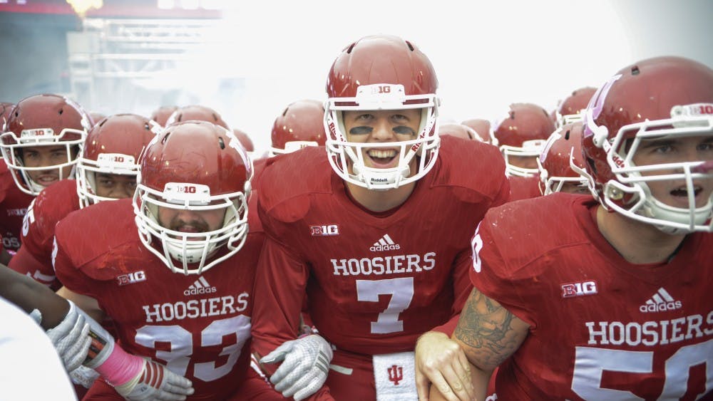 The team gets pumped up by coach Mark Hill before the game against Ohio State on Saturday at Memorial Stadium. The Hoosiers lost to the number one ranked Buckeyes, 27-34.
