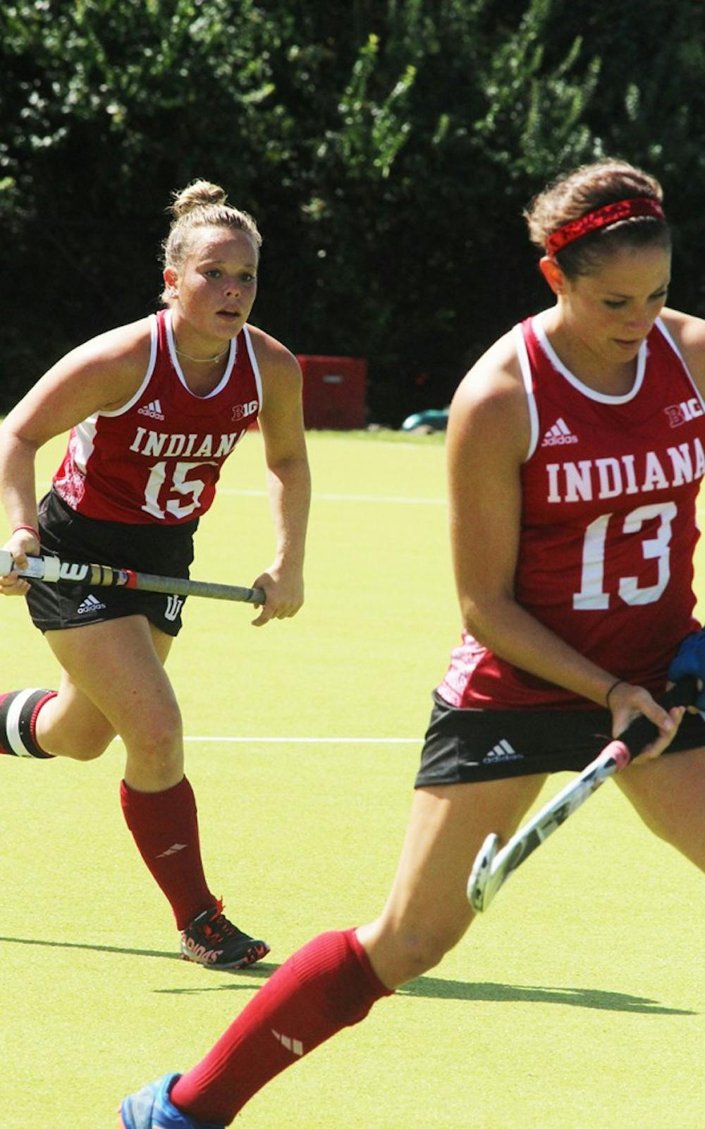  IU Field Hockey players, Kate Barber and Morgan Dye work together in their game Sunday against the University of New Hampshire. 