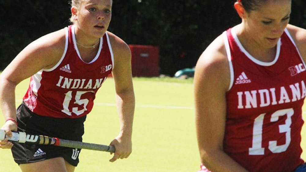  IU Field Hockey players, Kate Barber and Morgan Dye work together in their game Sunday against the University of New Hampshire. 