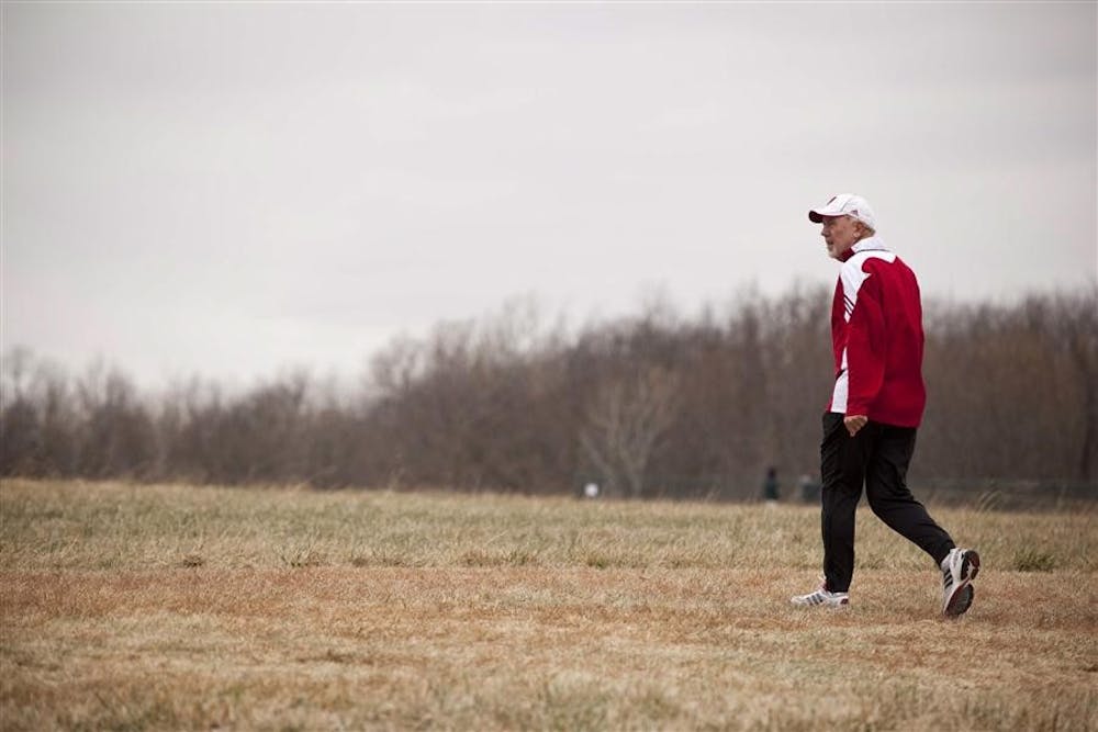 IU Director and Head Coach of Men’s and Women’s Track and Field and Cross Country Ron Helmer walks toward the course before the start of the men's NCAA Cross Country Championship race on Nov. 22, 2010, in Terre Haute.